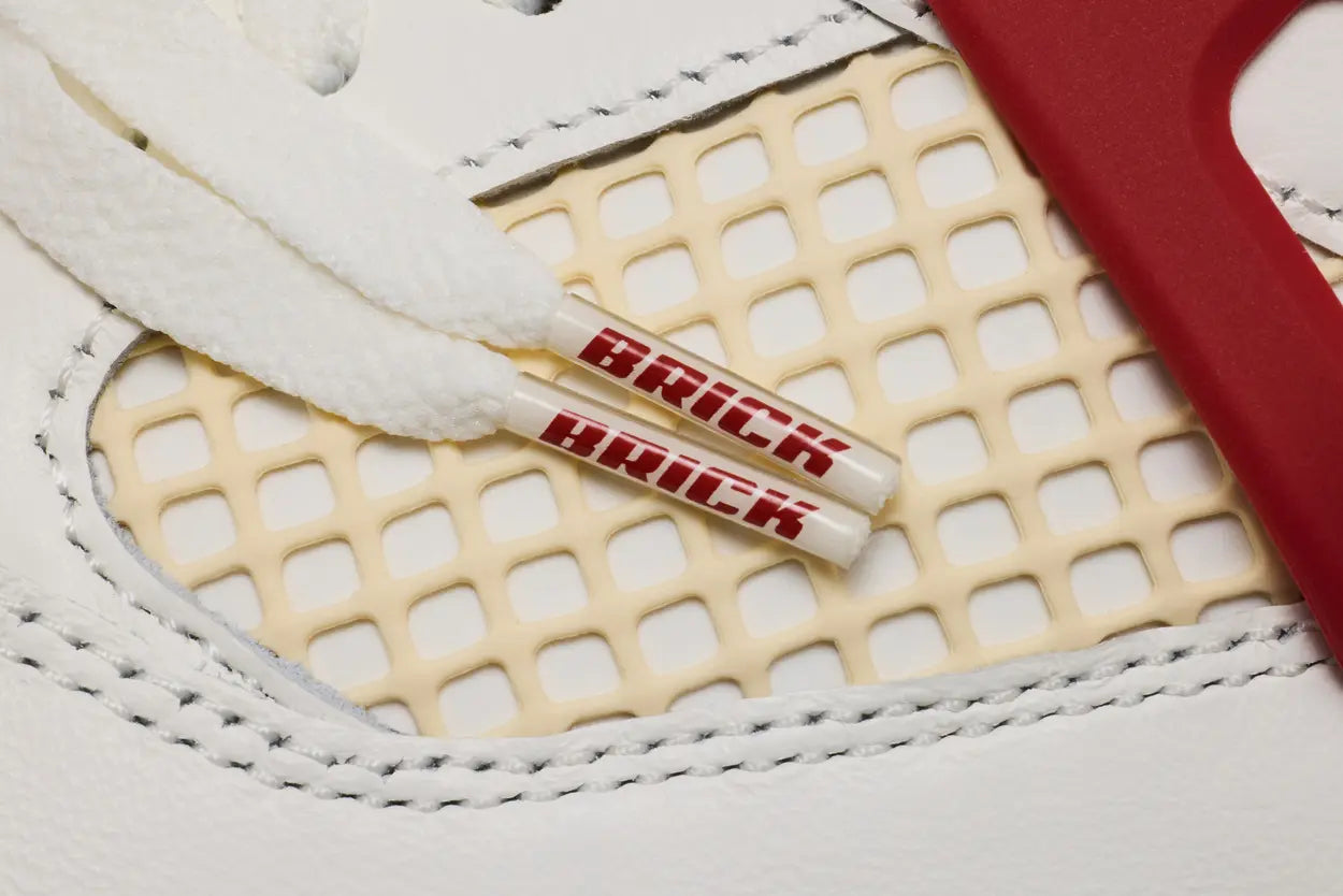 Nigel Sylvester x Air Jordan 4 Brick After Brick sneaker, angled view
