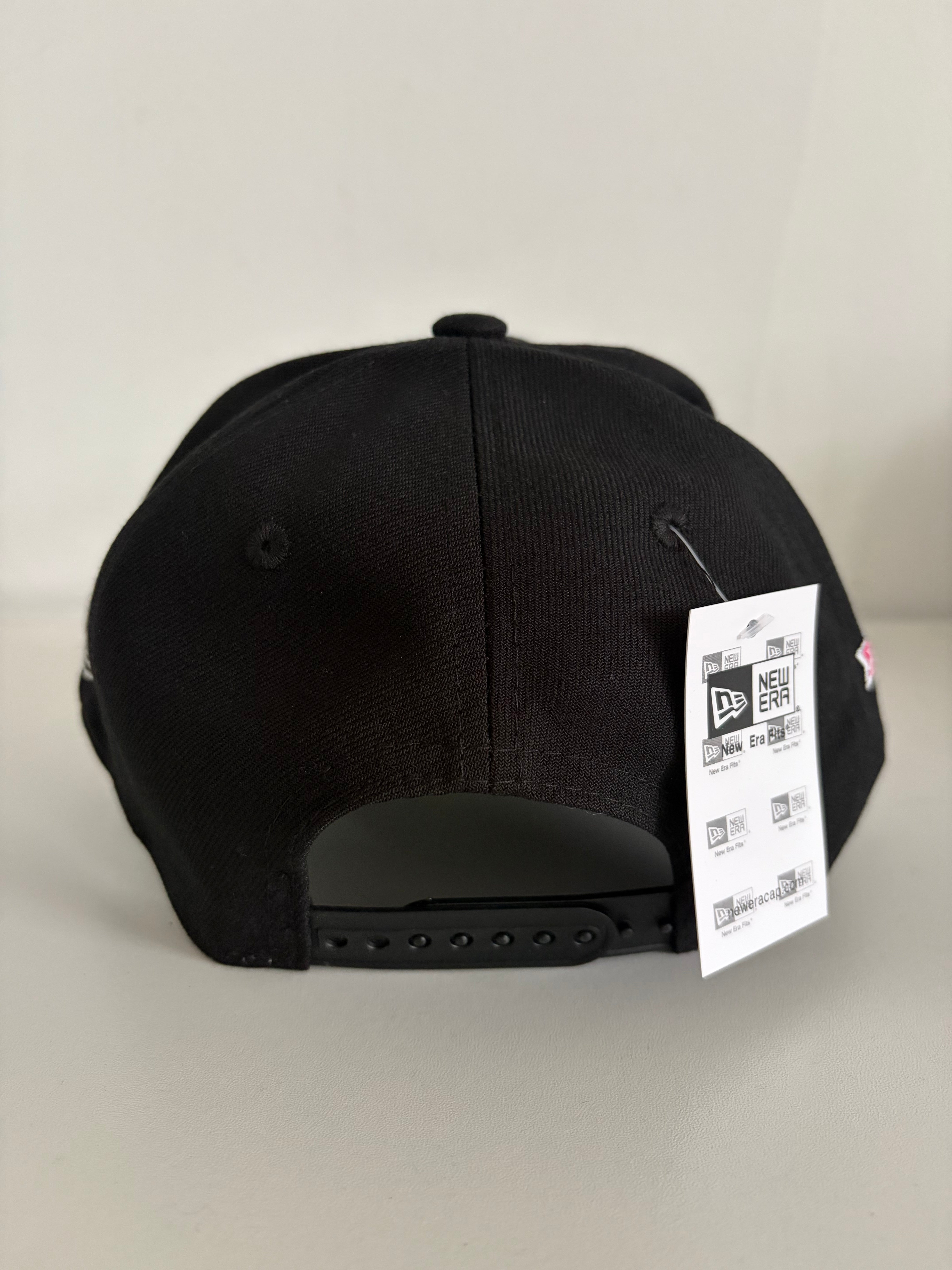 New Era LA Dodgers 9FORTY cap in black with pink rose, back view