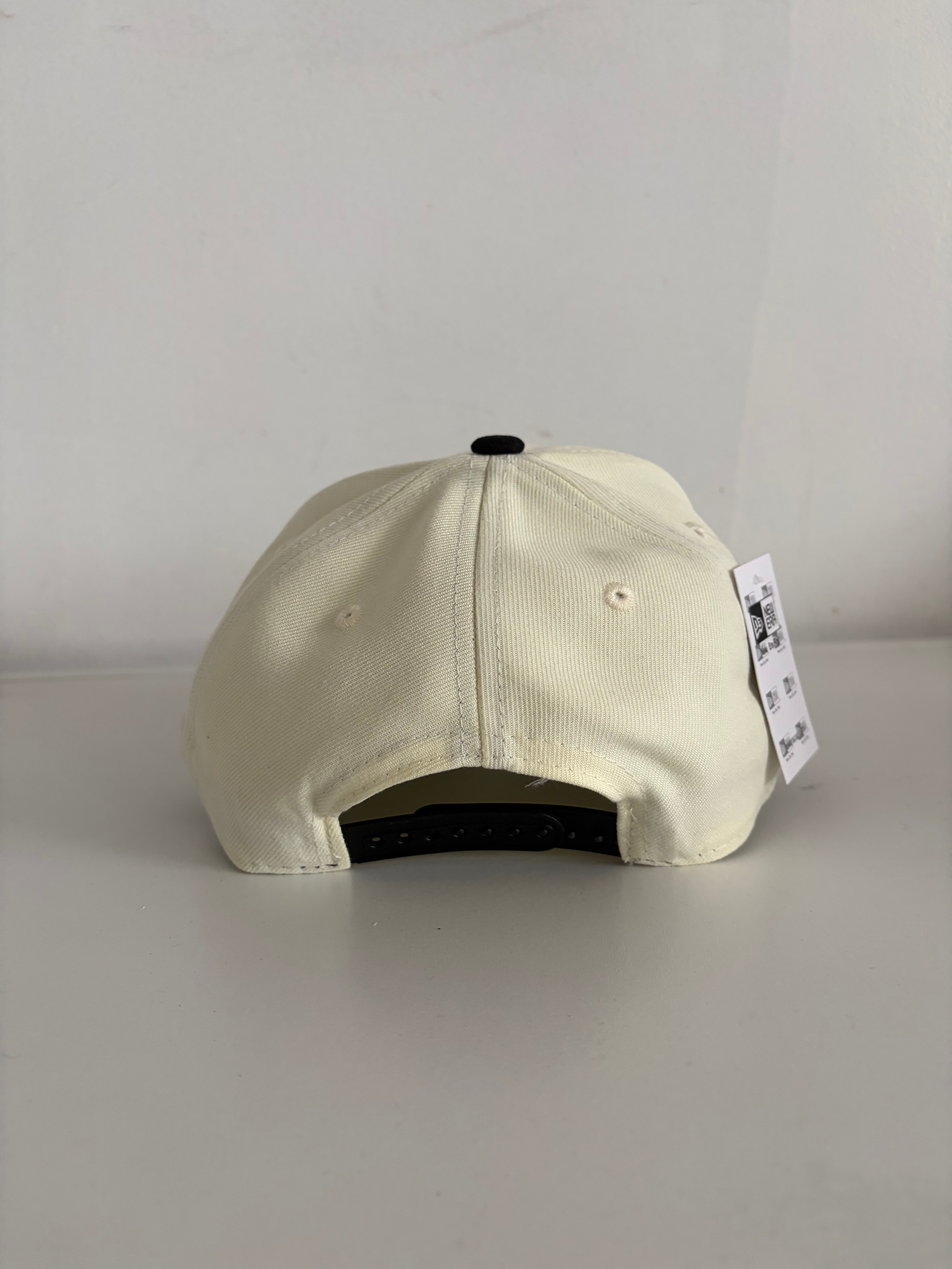 New Era NY Yankees 9FORTY cap in cream and black, back view