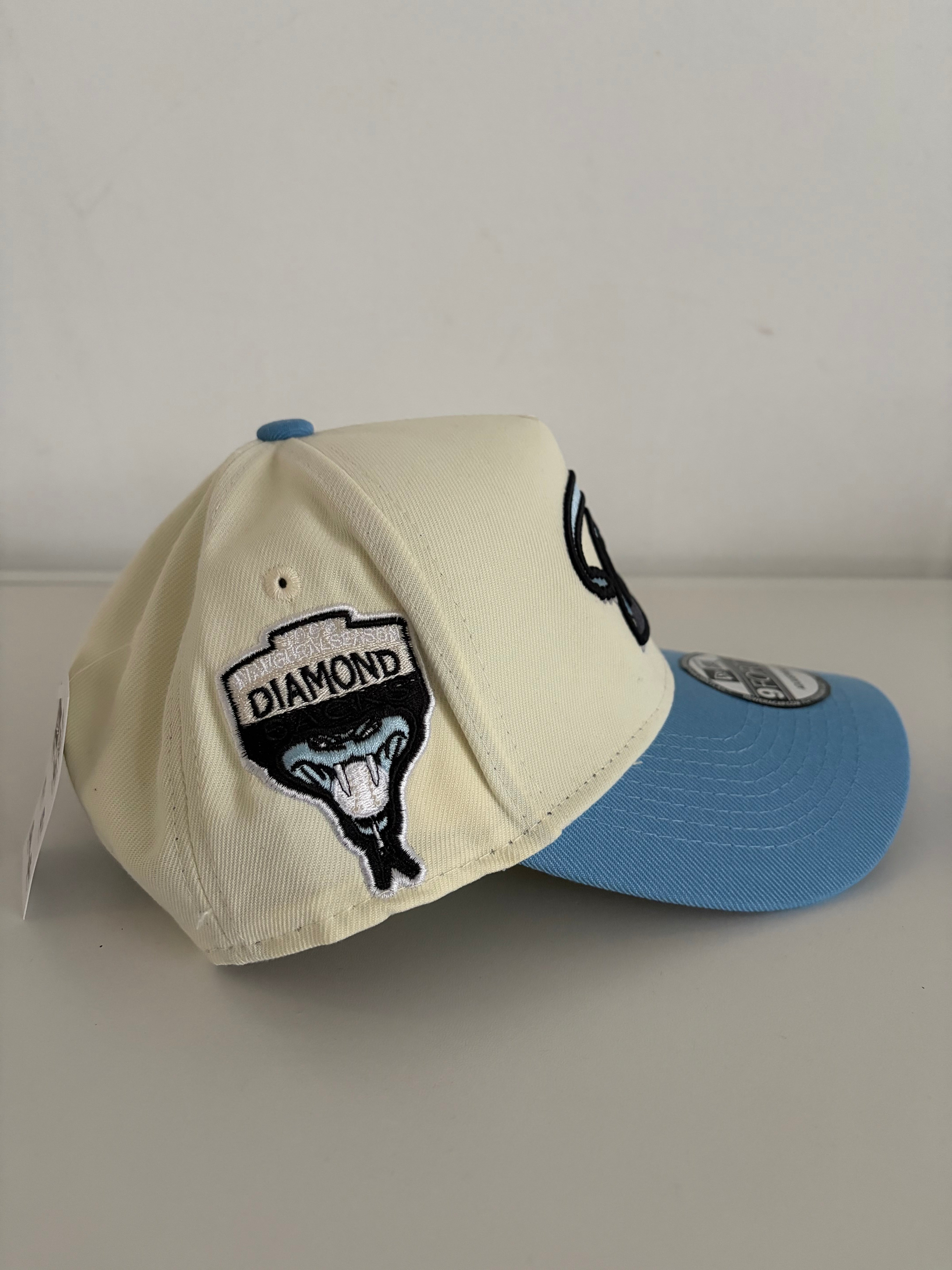 New Era Arizona Diamondbacks 9FORTY Adjustable Cap – Cream/Light Blue w/ Retro “D” Logo & Snake Patch